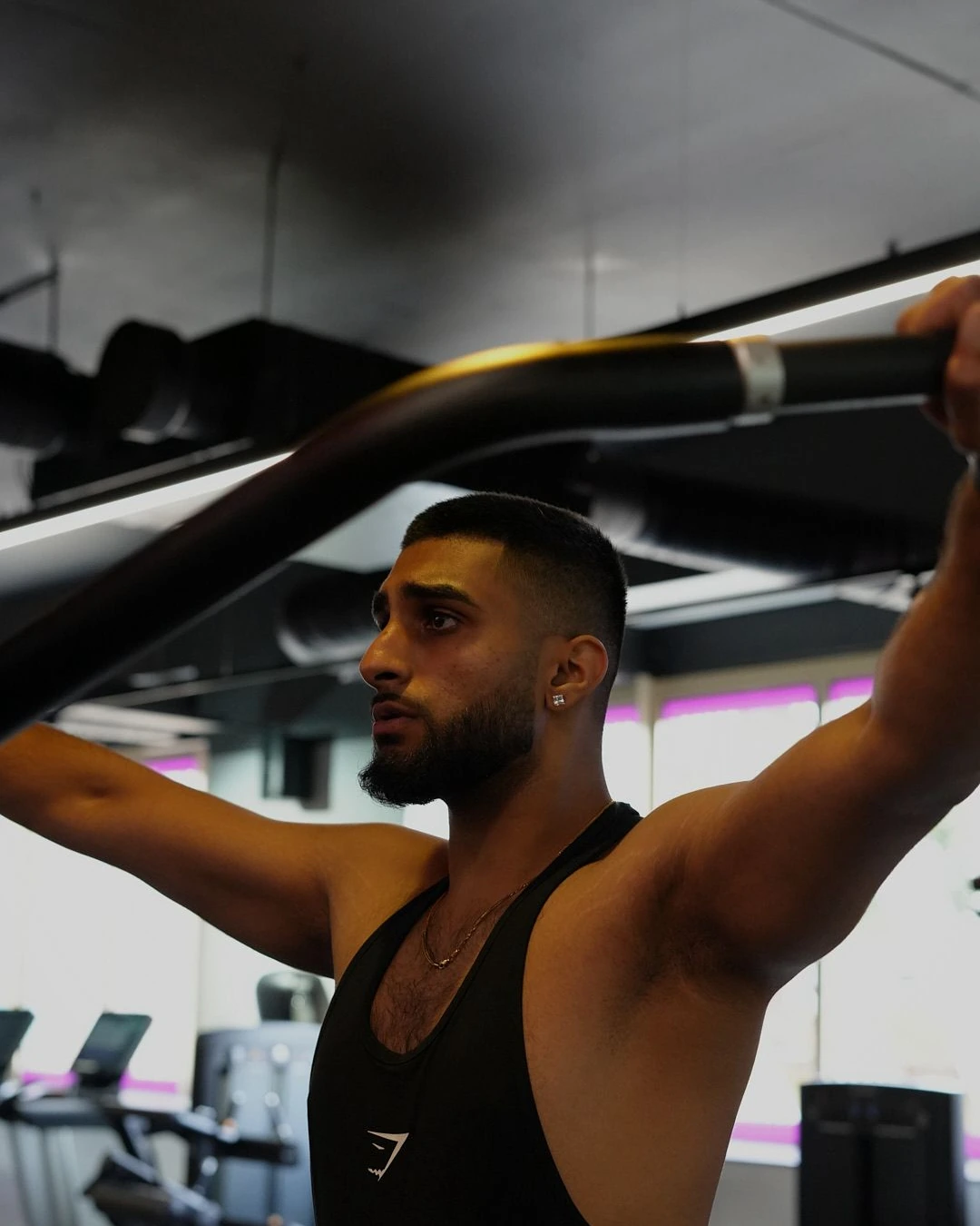 Anish Mehan training on the lat pulldown machine at the gym